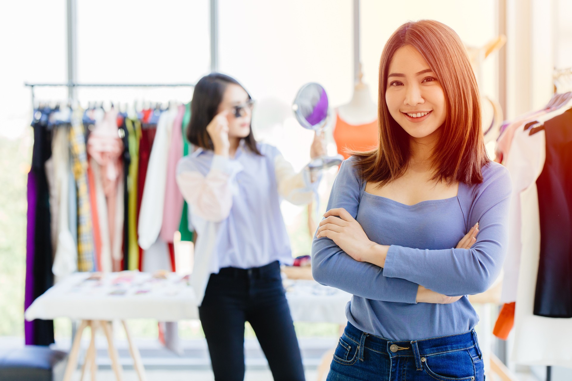 young new SME business owner happy and successful teen portrait with fashion clothing shop background